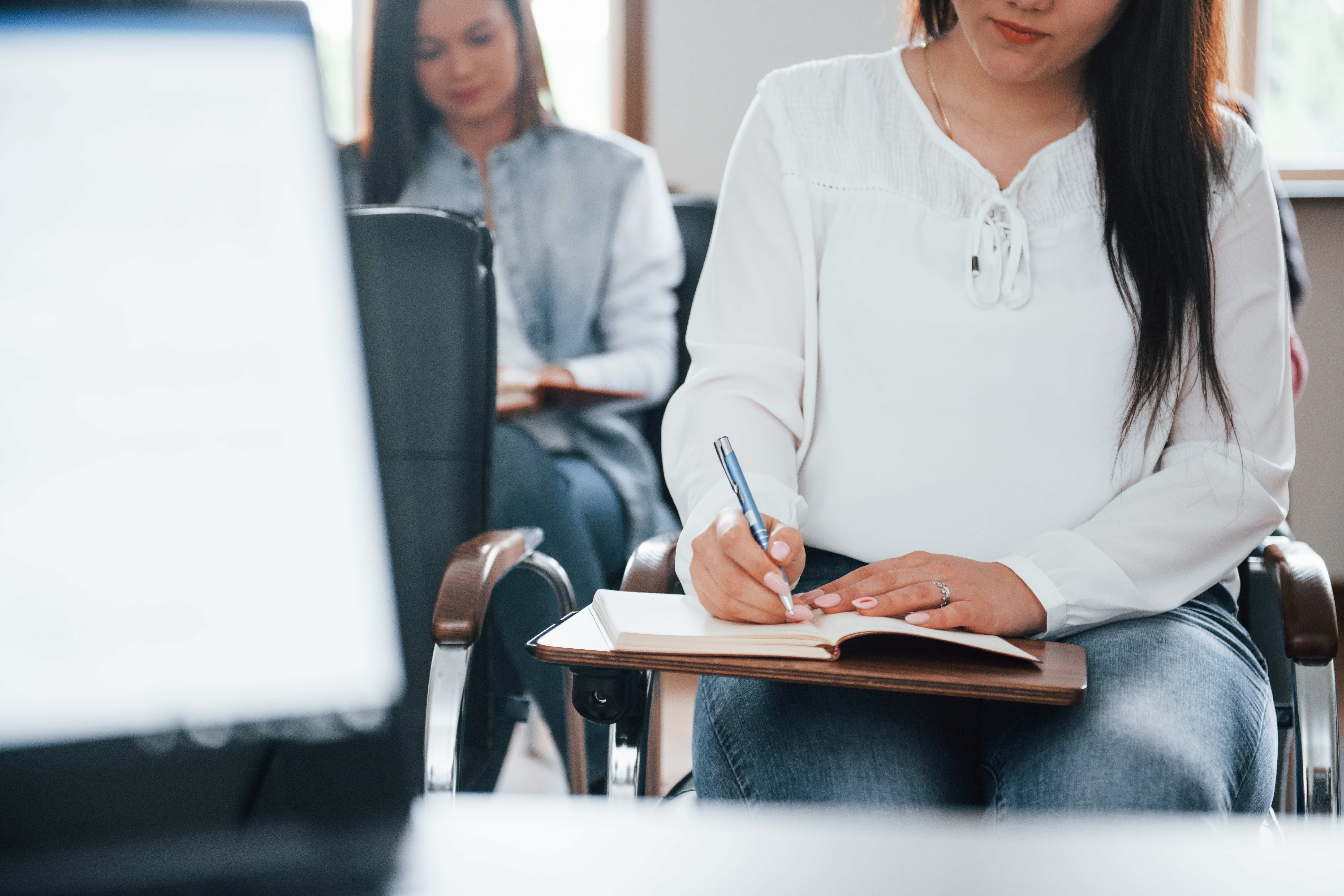 doing-some-notes-group-people-business-conference-modern-classroom-daytime
